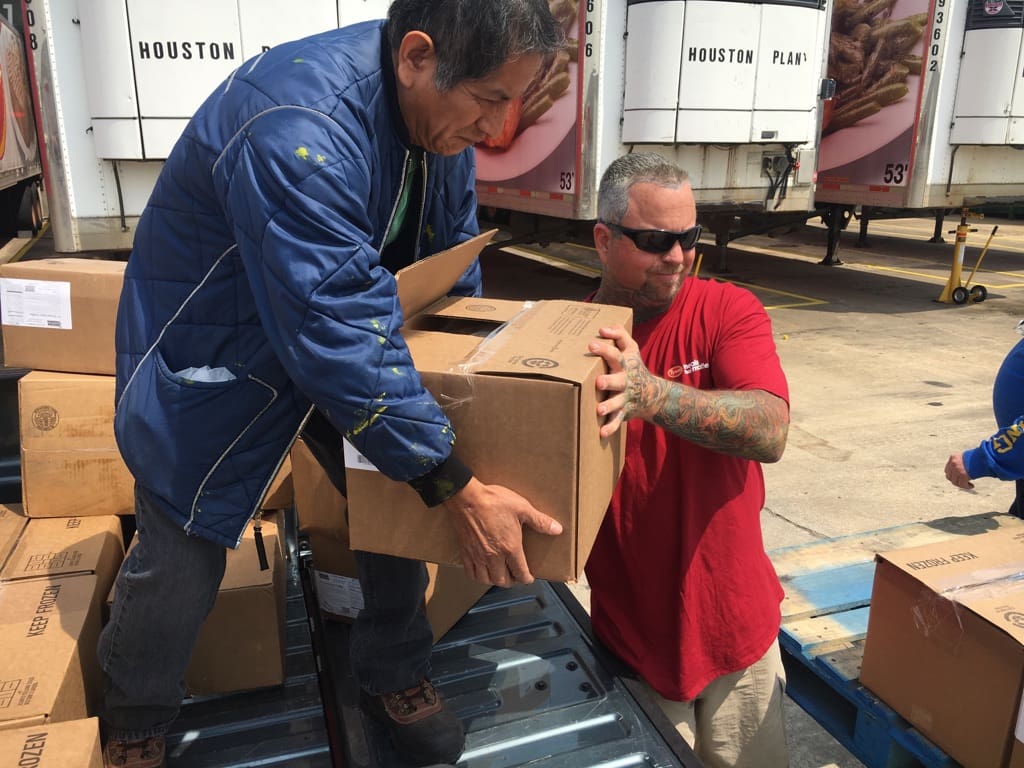 truckers unloading meals during Hurricane Harvey