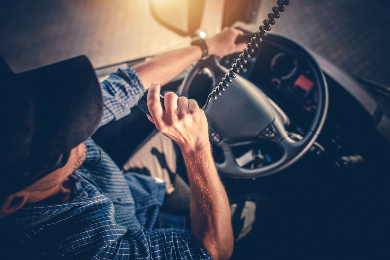 truck driver talking into walkie talkie