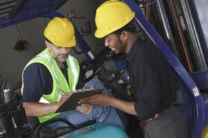 Workers in an industrial warehouse.