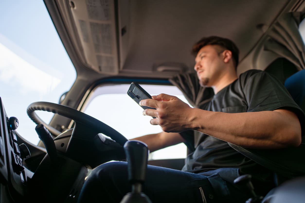Truck driver performing a pre-trip inspection at TDI’s training facility.