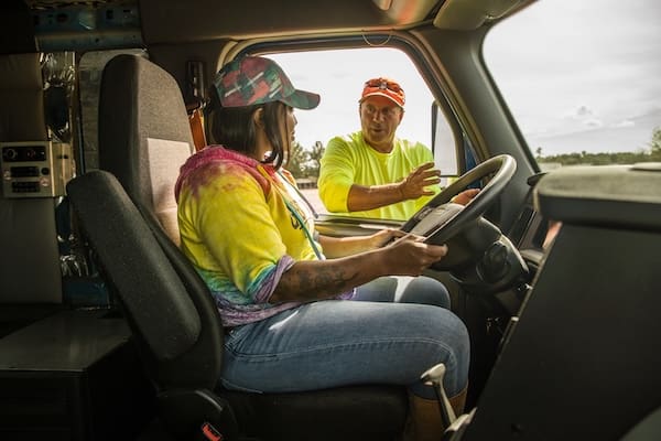 A student driver receives hands-on driving instruction for her CDL at TDI.